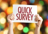 image showing a sign saying quick survey being held up by two human hands